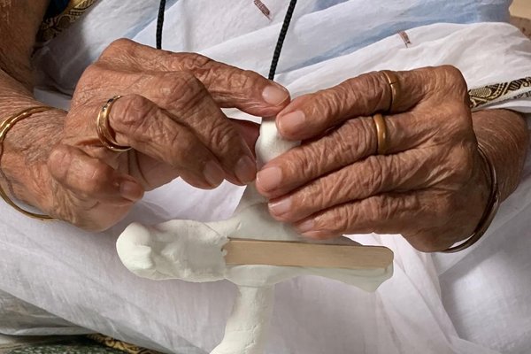Elderly hands sculpting